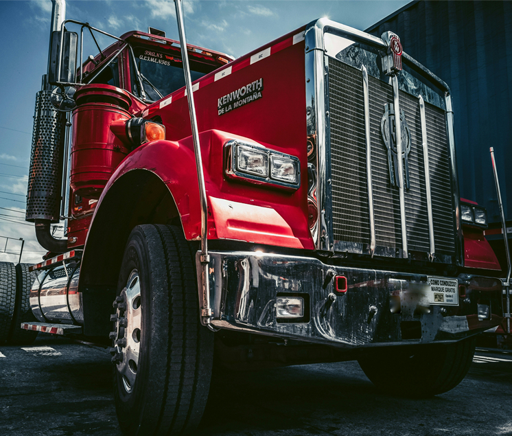 Photo by <a href="https://unsplash.com/@juanezl?utm_content=creditCopyText&utm_medium=referral&utm_source=unsplash">Esteban Zapata</a> on <a href="https://unsplash.com/photos/red-and-white-truck-on-black-asphalt-road-f8Nb18iHdPo?utm_content=creditCopyText&utm_medium=referral&utm_source=unsplash">Unsplash</a>